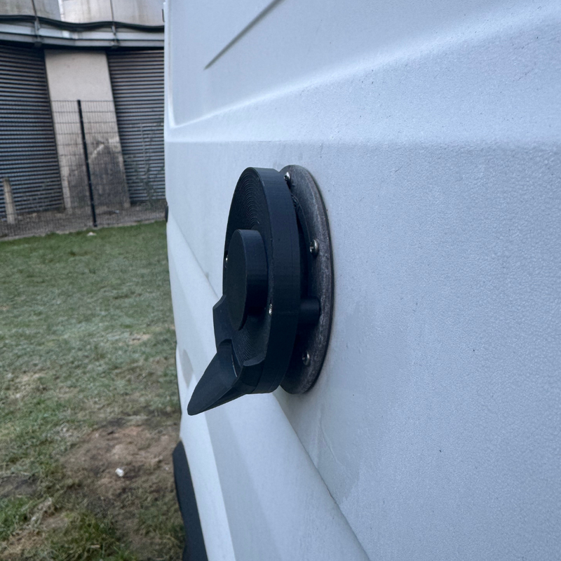 Truma boiler outlet drip cover fitted on campervan exterior